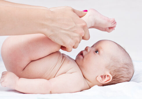 Baby,Massage.,Mother,Massaging,Baby's,Legs.,Isolated,On,White,Background